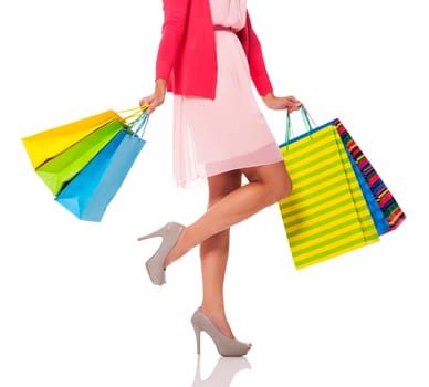 Woman holding colorful shopping bags