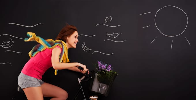 Happy woman on a bicycle