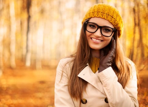 Portrait of beautiful woman at autumn