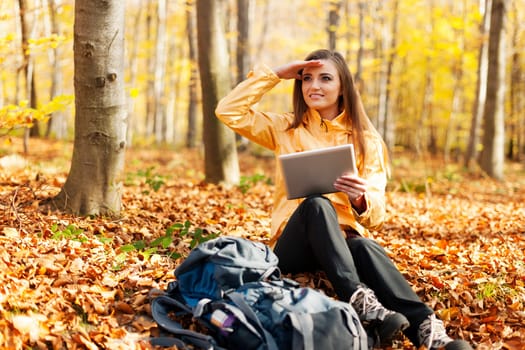 Female hiker has break and looking for something