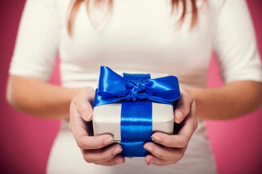 Woman hands holding gift