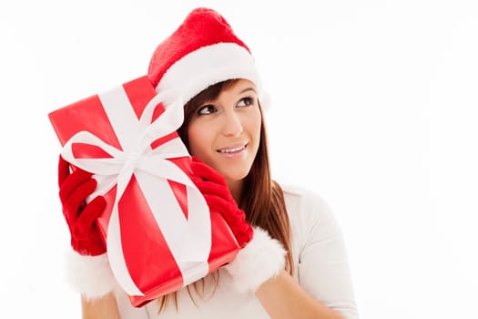Beautiful woman shaking christmas present