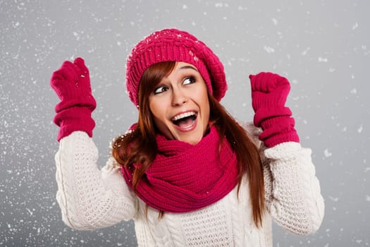 Young woman enjoys first snow