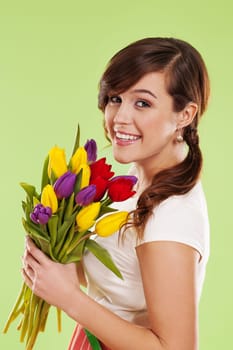 Portrait of a young woman with spring flowers