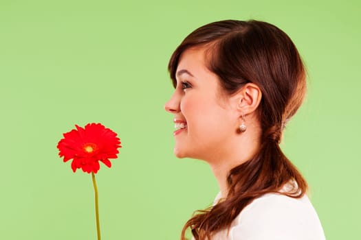 Pretty woman holding red flower