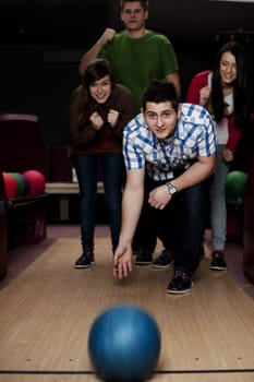 Friends bowling together