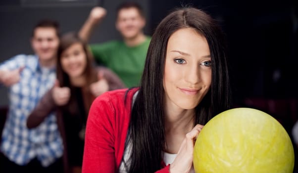 Friends bowling together