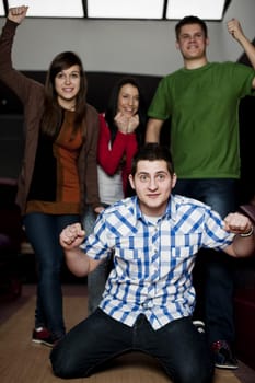 Friends bowling together