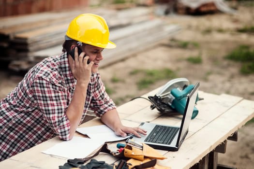 Carpenter talking on mobile phone