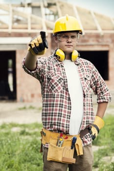 Construction worker pointing at something