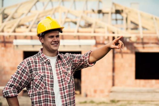 Construction worker pointing at something