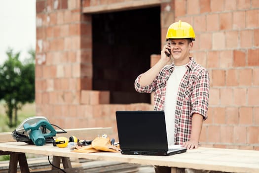 Carpenter talking on mobile phone