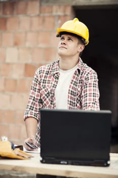 Carpenter worker with laptop