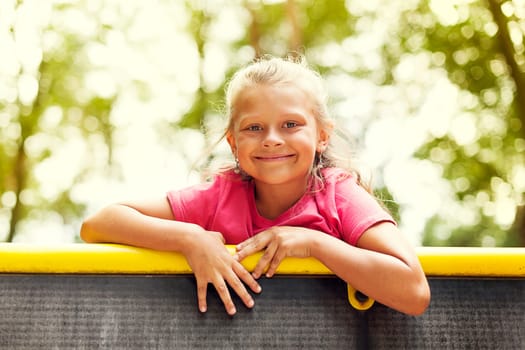 Portrait of little girl on playground