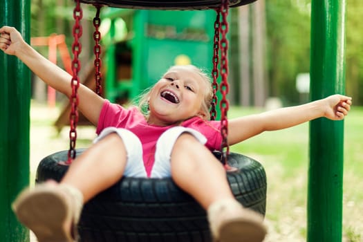 Happy girl having fun on playground