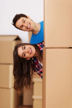 Couple having fun during  moving in new home