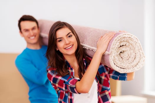 Young couple moving in to new house