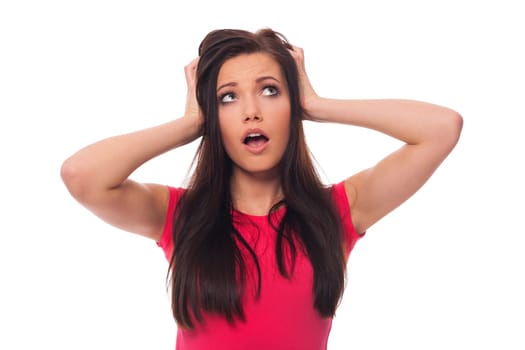 Young woman looking surprised on white background