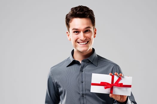 Happy man holding white card