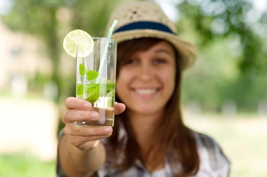 Young woman with mojito drink