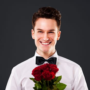 Handsome man with red roses
