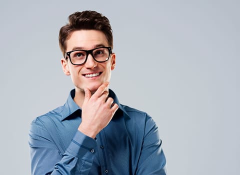Smart man with glasses looking up