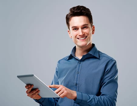 Happy man using digital tablet