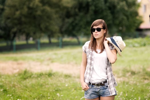 Beauty woman walking through meadow