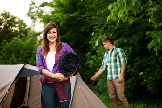 Young woman with sleeping bag