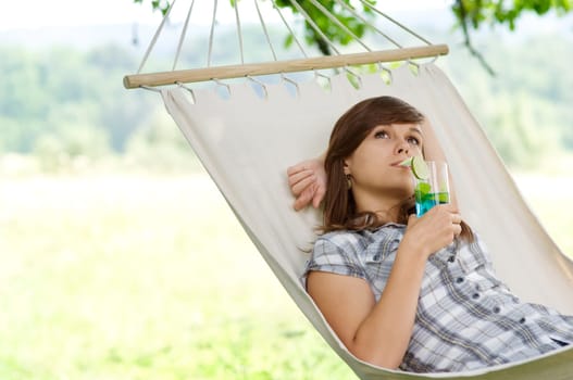 Young woman resting in hammock