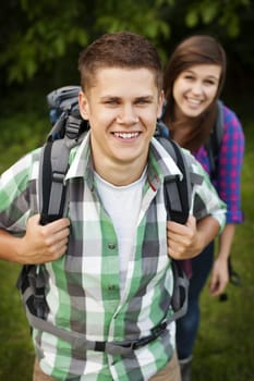 Young couple walking through forest