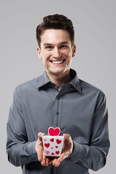 Man holding in his hands the love gift