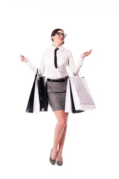 Happy businesswoman holding full of shopping bags