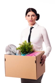 Businesswoman holding a box of personal items