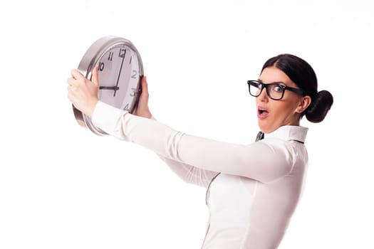 Shocked woman holding a office clock