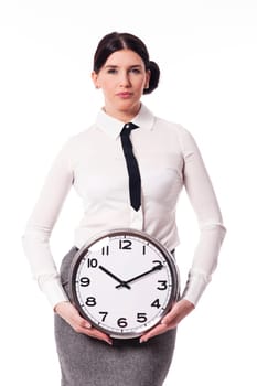 Beautiful businesswoman holding a clock