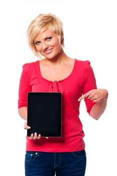 Smiling blonde woman pointing at screen of digital tablet