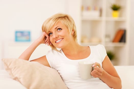 Resting with coffee on couch