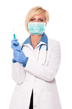 Blonde female doctor holding syringe