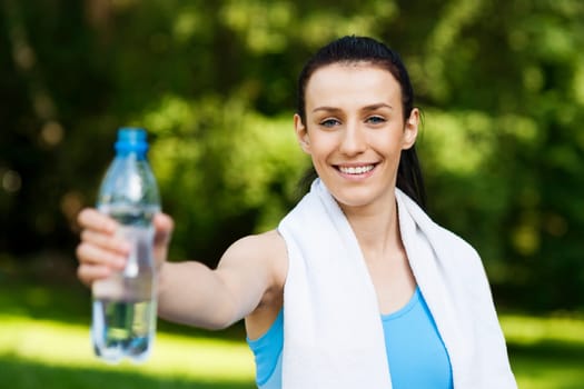 Young woman with bottle of water