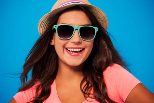 Summer woman wearing sunglasses and straw hat