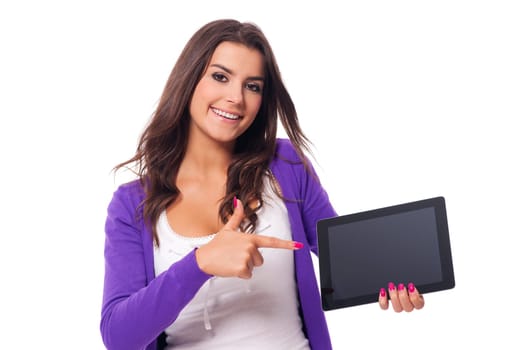 Smiling woman pointing at screen of digital tablet