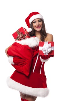 Sexy woman giving christmas gifts from sack of santa claus