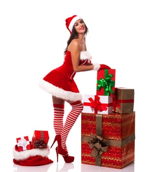 Smiling santa woman with many christmas presents