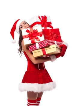 Sexy Mrs santa claus holding heavy stack of christmas gifts