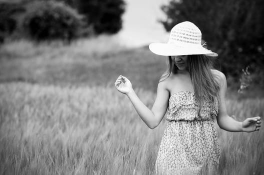 Beauty woman walking through meadow, Black and White
