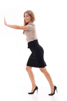 Businesswoman trying to push something