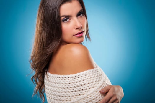Beauty woman wrapping on warm scarf