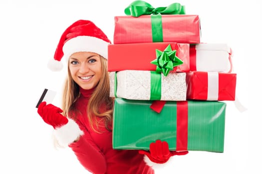 Beautiful woman holding christmas presents and credit card