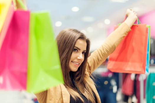 Satisfied woman with shopping bags